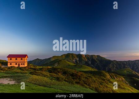 Asahi Mountain Range, morning glow, Kitsuneana shelter hut and Mt.Itoh(Itohdake),100 mountains of Japan, Yamagata, Tohoku, Japan, Asia Stock Photo