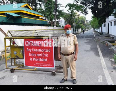 210506 -- GUWAHATI, May 6, 2021 -- A security guard keeps a tight vigil in front of the containment zone of Beltora area of Guwahati in India s north eastern state of Assam on May 6, 2021. India s COVID-19 tally surpassed 21 million on Thursday as 412,262 new cases were registered across the country in the past 24 hours, the health miniy said. /Xinhua INDIA-GUWAHATI-COVID-19 Str PUBLICATIONxNOTxINxCHN Stock Photo