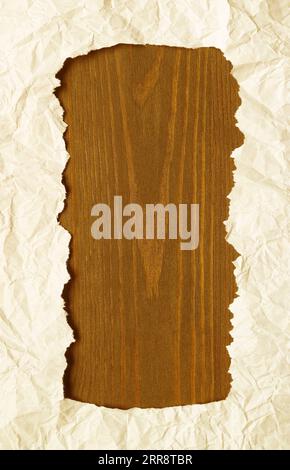 Ripped Off White Paper Frame with Golden Brown Wooden Copy Space Stock Photo