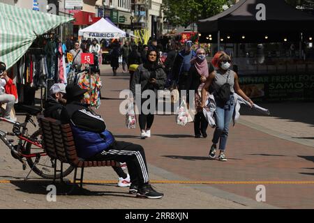 210520 -- BEDFORD, May 20, 2021 -- A man walks beside the River Great ...