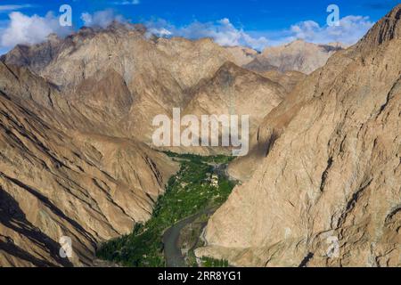 210520 -- AKTO, May 20, 2021 -- Aerial photo taken on May 12, 2021 shows the view of Alimalik Village of Akto County, northwest China s Xinjiang Uygur Autonomous Region. Chen Fangying, a 24-year-old village teacher, is from southwest China s Guizhou Province. When she graduated from college two years ago, she chose to become a teacher in Xinjiang. The primary school where Chen teaches is located in the Kunlun Mountains, more than 1,800 kilometers away from Xinjiang s capital city Urumqi. For me, this is the life I should live in my twenties, said Chen. Chen Fangying has more than ten classes e Stock Photo