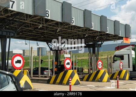 Toll road, also known as a turnpike or tollway, is a public or private road (almost always a controlled-access highway), Toll Plaza Liefkenshoektunnel Stock Photo