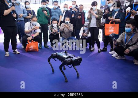 210526 -- GUIYANG, May 26, 2021 -- Visitors look at a robotic dog during the China International Big Data Industry Expo 2021 in Guiyang, southwest China s Guizhou Province, May 26, 2021. The expo opened here on Wednesday, showcasing cutting-edge scientific and technological innovations and achievements in relevant areas.  CHINA-GUIZHOU-GUIYANG-BIG DATA INDUSTRY EXPO-TECHNOLOGY CN JinxLiwang PUBLICATIONxNOTxINxCHN Stock Photo