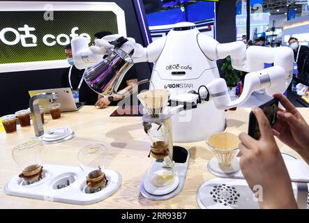 210526 -- GUIYANG, May 26, 2021 -- An AI-powered robot brews coffee during the China International Big Data Industry Expo 2021 in Guiyang, southwest China s Guizhou Province, May 26, 2021. The expo opened here on Wednesday, showcasing cutting-edge scientific and technological innovations and achievements in relevant areas.  CHINA-GUIZHOU-GUIYANG-BIG DATA INDUSTRY EXPO-TECHNOLOGY CN YangxWenbin PUBLICATIONxNOTxINxCHN Stock Photo