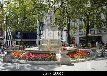 The statue of William Shakespeare and fountain in Leicester Square, London, UK. Stock Photo