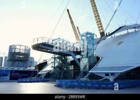 London, UK, External View of  The O2 Entrance, showing visitors on the roof climb. Stock Photo