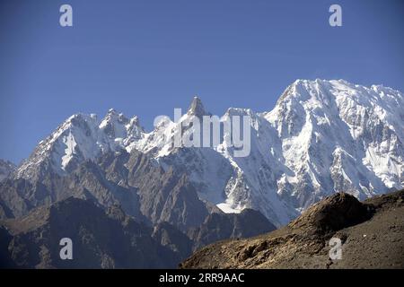 210605 -- ISLAMABAD, June 5, 2021 -- File photo taken on Oct. 16, 2020 shows the scenery of snow-covered mountains in Pakistan s northern Gilgit-Baltistan region. TO GO WITH Feature: Pakistan determined to battle climate change for future generations  PAKISTAN-HUNZA-ENVIRONMENT AhmadxKamal PUBLICATIONxNOTxINxCHN Stock Photo