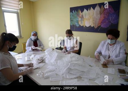 210626 -- ANKARA, June 26, 2021 -- Workers make masks at a mask factory in Ankara, Turkey, on June 26, 2021. Turkey on Saturday confirmed 5,266 new COVID-19 cases, including 470 symptomatic ones, raising the total number in the country to 5,404,144, according to its health ministry. Photo by /Xinhua TURKEY-ANKARA-COVID-19-MASK FACTORY MustafaxKaya PUBLICATIONxNOTxINxCHN Stock Photo