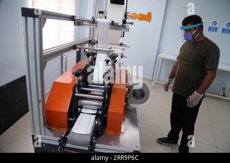 210626 -- ANKARA, June 26, 2021 -- A worker makes masks at a mask factory in Ankara, Turkey, on June 26, 2021. Turkey on Saturday confirmed 5,266 new COVID-19 cases, including 470 symptomatic ones, raising the total number in the country to 5,404,144, according to its health ministry. Photo by /Xinhua TURKEY-ANKARA-COVID-19-MASK FACTORY MustafaxKaya PUBLICATIONxNOTxINxCHN Stock Photo
