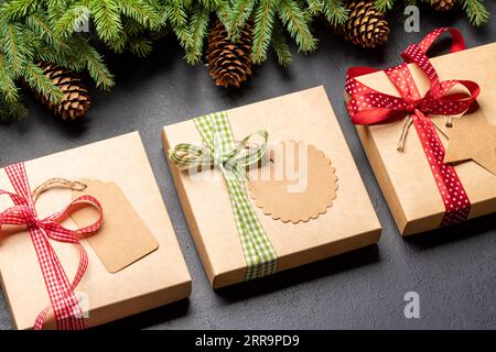 Christmas fir tree branch and various gift boxes Stock Photo
