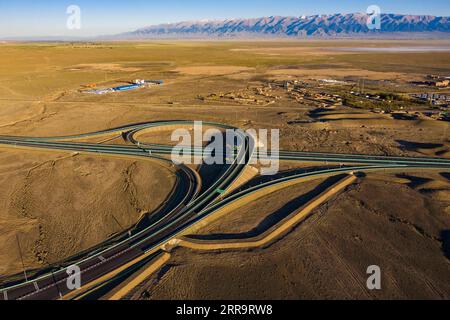 210630 -- BEIJING, June 30, 2021 -- Aerial photo taken on June 28, 2021 shows a view of a flyover of the Beijing-Urumqi Expressway in Kazak Autonomous County of Barkol, northwest China s Xinjiang Uygur Autonomous Region.  Xinhua Headlines: World s longest desert-crossing expressway in full operation HuxHuhu PUBLICATIONxNOTxINxCHN Stock Photo