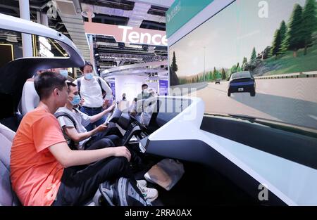 210708 -- SHANGHAI, July 8, 2021 -- Visitors try automatic driving at the 2021 World Artificial Intelligence Conference WAIC in east China s Shanghai, July 8, 2021. The 2021 WAIC kicked off in China s Shanghai on Thursday. With the theme of Intelligent Connectivity, Inspirational Cities , this year s conference is aimed to promote global exchange and cooperation, and enhance the common welfare of mankind. More than 10 AI chips, as well as innovative products brought by more than 300 major AI companies, will be shown at the conference, which will last to Saturday.  EyesonSciCHINA-SHANGHAI-AI-CO Stock Photo