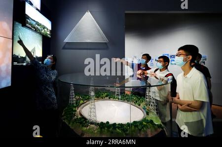 210718 -- SHANGHAI, July 18, 2021 -- People visit the Shanghai Astronomy Museum in east China s Shanghai, July 18, 2021. The Shanghai Astronomy Museum, the world s largest planetarium in terms of building scale, opened to the public on Sunday. Covering an area of approximately 58,600 square meters, the museum is located in the China Shanghai Pilot Free Trade Zone Lingang Special Area. It is a branch of the Shanghai Science and Technology Museum.  CHINA-SHANGHAI-ASTRONOMY MUSEUM CN FangxZhe PUBLICATIONxNOTxINxCHN Stock Photo