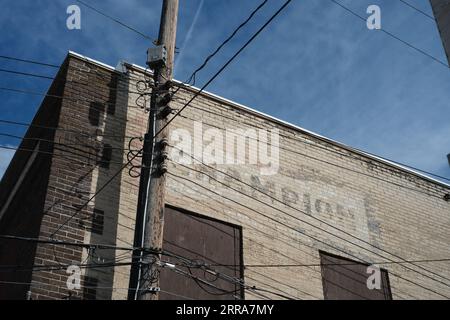 Faded Champion spark plug sign painted on an old building in Bay City Michigan Stock Photo