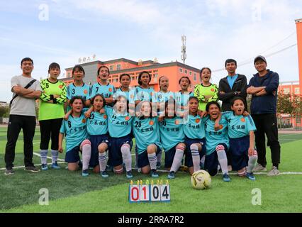 210720 -- URUMQI, July 20, 2021 -- Members of a female football team set up with the support of south China s Guangdong Province pose for photo in Payzawat County, northwest China s Xinjiang Uygur Autonomous Region, April 24, 2021. Photo by /Xinhua Xinhua Headlines: China pools resources to help Xinjiang achieve moderate prosperity YangxHao PUBLICATIONxNOTxINxCHN Stock Photo