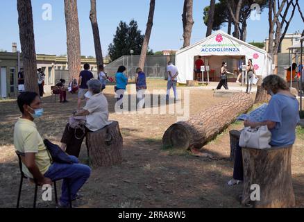 210721 -- ROME, July 21, 2021 -- People wait to register for the COVID-19 vaccination at a vaccination center in Rome, Italy, on July 21, 2021. Over half of the population targeted by Italy s coronavirus vaccination campaign has already been fully immunized, the country s health authorities said here on Monday.  ITALY-ROME-COVID-19-VACCINATION JinxMamengni PUBLICATIONxNOTxINxCHN Stock Photo