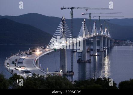 210729 -- KOMARNA, July 29, 2021 -- Photo taken on July 28, 2021 shows the construction site of the Peljesac Bridge at Mali Ston Bay near Komarna of southern Croatia. The final piece of steel box girder for the Peljesac Bridge in southern Croatia was lifted and welded with the main structure on late Wednesday night. The 2.4-km cable-stayed bridge over the Mali Ston Bay of the Adriatic Sea connects Croatian mainland and the Peljesac Peninsula of its southernmost Dubrovnik-Neretva County, bypassing a short strip of Bosnian and Herzegovina s territory. /Pixsell via Xinhua CROATIA-KOMARNA-PELJESAC Stock Photo