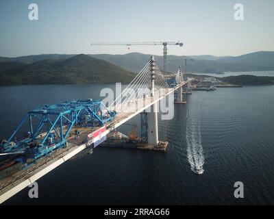 210730 -- KOMARNA, July 30, 2021 -- Aerial photo taken on July 29, 2021 shows the connected Peljesac Bridge at Mali Ston Bay near Komarna of southern Croatia. The final piece of steel box girder for the Peljesac Bridge in southern Croatia was lifted and welded with the main structure on late Wednesday night. The 2.4-km cable-stayed bridge over the Mali Ston Bay of the Adriatic Sea connects Croatian mainland and the Peljesac Peninsula of its southernmost Dubrovnik-Neretva County, bypassing a short strip of Bosnian and Herzegovina s territory.  CROATIA-KOMARNA-PELJESAC BRIDGE GaoxLei PUBLICATION Stock Photo
