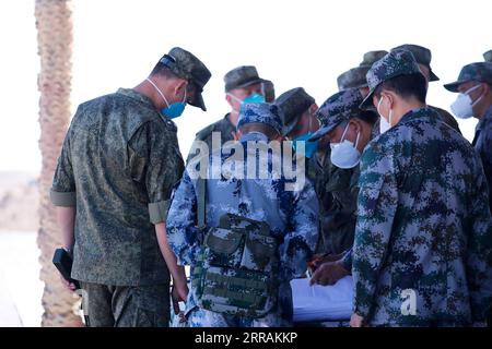 210805 -- YINCHUAN, Aug. 5, 2021 -- Chinese and Russian military personnel communicate on a joint military drill at a training ground on Aug. 5, 2021. A joint military exercise by the Chinese and Russian armies will be held from Aug. 9 to 13 at a training base of the People s Liberation Army PLA in northwest China s Ningxia Hui Autonomous Region. TO GO WITH Chinese, Russian militaries to hold joint drill in NW China  CHINA-RUSSIA-MILITARIES-JOINT DRILL-PREPARATION CN LiuxFang PUBLICATIONxNOTxINxCHN Stock Photo