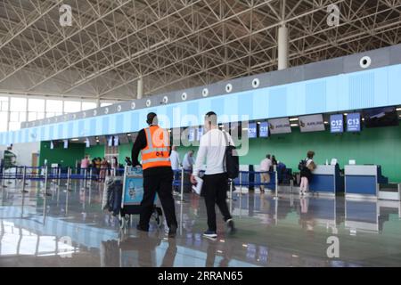 210809 -- LUSAKA, Aug. 9, 2021 -- Passengers are seen in the second terminal building at the Kenneth Kaunda International Airport in Lusaka, Zambia, Aug. 9, 2021. Zambia on Monday launched a modern airport terminal, which has been built by a Chinese company. The southern African nation launched the second terminal building at the Kenneth Kaunda International Airport, which will increase the number of passengers from the current two million to four million per year. The project, financed by the Export-Import Bank of China China Exim Bank, is designed and built by China Jiangxi Corporation for I Stock Photo