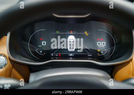Modern car illuminated dashboard, designed to provide a clear and concise view of your vehicle's vital information. Stock Photo