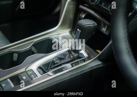 Modern car gear lever with intuitive control buttons. Effortless shifting, a symphony of ergonomic design. Stock Photo