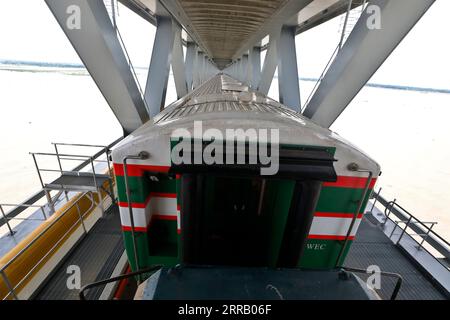 Munshiganj, Bangladesh - September 07, 2023: A special train operated by Bangladesh Railway on a test run on the 82-km Dhaka-Bhanga line via the Padma Stock Photo