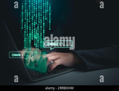 Hackers work on laptops in the dark. The concept of information security in the Internet network and information espionage. Stock Photo