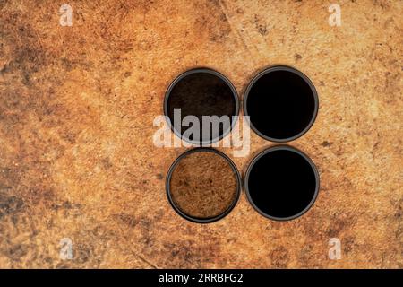 Four round glass ND neutral density filters for cameras Stock Photo