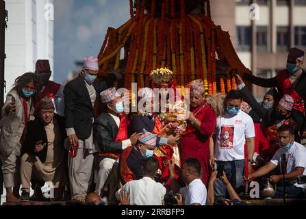 210919 -- KATHMANDU, Sept. 19, 2021 -- Living goddess Kumari is carried during Indra Jatra festival in Kathmandu, Nepal on Sept. 19, 2021. The Indra Jatra festival celebrates Indra, the god of rain.  NEPAL-KATHMANDU-INDRA JATRA SulavxShrestha PUBLICATIONxNOTxINxCHN Stock Photo