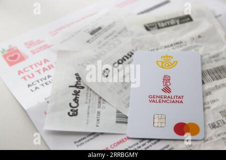 Close-up of a prepaid card from the Generalitat Valenciana (Spain) to help overcome the food price inflation crisis Stock Photo