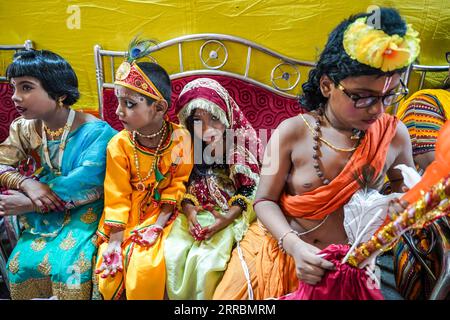 Children dressed up as Hindu deity lord Krishna and Radha are seen inside the temple during the celebration of Janmashtami festival. Devotees across India celebrate the birth anniversary of lord Krishna during the Janmashtami festival. Stock Photo