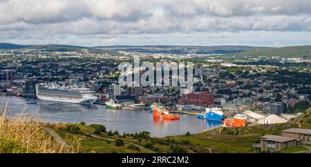 St. John's, NL, Canada - Aug. 27, 2023: Looking down on the city of St. John's from Signal Hill with a view of ships in the harbor. Stock Photo