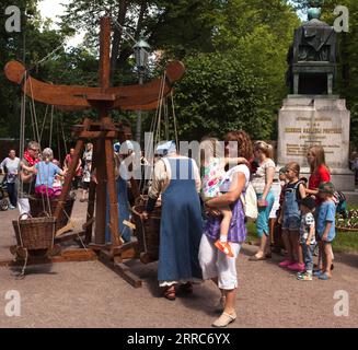 TURKU, FINLAND ON JUNE 30, 2017. Snapshot of unidentified people, and kids in a playground on the Medieval Market. Editorial use Stock Photo