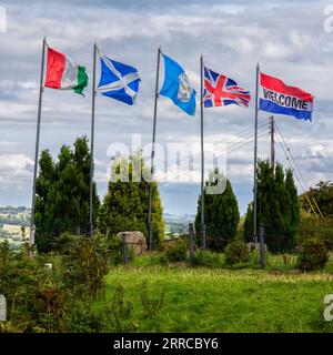 Flags of Italy, Scotland, Yorkshire, Great Britain (Union Jack) and the Netherlands flying on the edge of Ilkley Moor in Yorkshire. Stock Photo