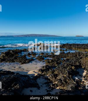 Tide Pools on Lava at Little Beach With Kaho'olawe Island on The Horizon, Makena Beach State Park, Maui, Hawaii, USA Stock Photo