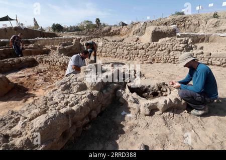 211129 -- YAVNE, Nov. 29, 2021 -- Staff members of Israel Antiquities Authority IAA work at an excavation site in central Israeli city of Yavne on Nov. 29, 2021. Israeli archaeologists have discovered remains of an industrial building and a nearby wide cemetery, both dating back to about 1,900 years ago, the Israel Antiquities Authority IAA said Monday. This is the first building discovered in the ancient central city of Yavne from the time of the Sanhedrin, which was the supreme legislative Jewish assembly. Photo by /Xinhua ISRAEL-YAVNE-ARCHAEOLOGY GilxCohenxMagen PUBLICATIONxNOTxINxCHN Stock Photo