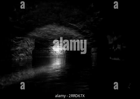 Kayaking a abandoned silica mine that is flooded with water. Stock Photo