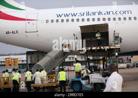 211207 -- COLOMBO, Dec. 7, 2021 -- The remains of Priyantha Kumara, a Sri Lankan manager killed by a mob in Pakistan last week, arrive at the Bandaranaike International Airport in Colombo, Sri Lanka, Dec. 6, 2021. Kumara, who was employed in a factory in Sialkot in Pakistan as an export manager, was brutally killed by a mob on Friday on allegations that he tore a poster pasted on the wall of the factory bearing religious sentiments. His body was later dragged on the road and set on fire by the mob, receiving global condemnation. Photo by /Xinhua SRI LANKA-COLOMBO-REMAINS-MANAGER-PAKISTAN-ARRIV Stock Photo