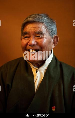211212 -- LHASA, Dec. 12, 2021 -- This is the portrait of Thubten Gyaltsen taken on May 11, 2021. Thubten Gyaltsen, 81, led a miserable life before the democratic reform in Tibet in 1959. His parents passed away because of heavy workload as serfs in his childhood. To make a living, Thubten started working for the rich at the age 13. Being in rags and starvation was the most profound memory of my adolescence, he recalled. Thubten embraced a brand new life in 1959 when democratic reform was launched and feudal serfdom was finally abolished in Tibet. The Communist Party of China has liberated us Stock Photo