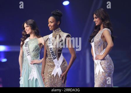 211213 -- EILAT, Dec. 13, 2021 -- Indian contestant Harnaaz Sandhu, South African contestant Lalela Mswane and Paraguayan contestant Nadia Ferreira from R to L participate in the 70th Miss Universe in southern Israeli city of Eilat on Dec. 13, 2021. Miss India Harnaaz Sandhu was crowned as the 70th Miss Universe at the pageant held on the night between Sunday and Monday at Israel s southernmost resort city of Eilat. Sandhu, a 21-year-old actress and model, beat 79 other contestants and won a third title for her country, following previous Indian wins in 1994 and 2000. She was crowned by the pr Stock Photo