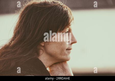 Close-up of thoughtful mature woman looking away Stock Photo