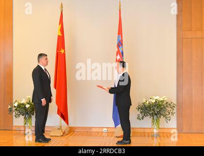 211217 -- ZAGREB, Dec. 17, 2021 -- Croatian President Zoran Milanovic L receives the credentials presented by Chinese Ambassador to Croatia Qi Qianjin in Zagreb Dec. 16, 2021. Zoran Milanovic on Thursday reaffirmed his country s adherence to the one-China principle and its respect for China s sovereignty and security.  CROATIA-ZAGREB-PRESIDENT-CHINESE AMBASSADOR-CREDENTIALS LixXuejun PUBLICATIONxNOTxINxCHN Stock Photo