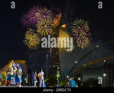 News Bilder des Tages 211217 -- DOHA, Dec. 17, 2021 -- People watch fireworks on the eve of Qatar National Day in Doha, Qatar, on Dec. 17, 2021. Qatar will celebrate its National Day on Dec. 18. Photo by /Xinhua QATAR-DOHA-NATIONAL DAY-FIREWORKS Nikku PUBLICATIONxNOTxINxCHN Stock Photo