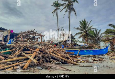 211222 -- LEYTE PROVINCE, Dec. 22, 2021 -- Photo shows a fishing community damaged by Typhoon Rai along a shoreline in Leyte Province, the Philippines, Dec. 22, 2021. The National Disaster Risk Reduction and Management Council NDRRMC reported that 156 people died from the typhoon, while the Philippine National Police reported at least 375 deaths. Many more are missing or injured. On Thursday afternoon, Typhoon Rai first swept across Siargao Island, off the eastern coast on Mindanao island in the southern Philippines. It lashed the Southeast Asian country for three days, causing flooding and la Stock Photo