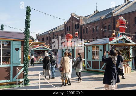 People visit the Christmas Market at Yokohama Red Brick Warehouse ...