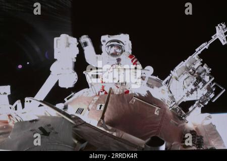 211230 -- BEIJING, Dec. 30, 2021 -- Screen image taken at Beijing Aerospace Control Center on Nov. 8, 2021 shows Chinese taikonaut Zhai Zhigang waving his hand after completing extravehicular activities. Xinhua s top 10 world news events in 2021 World again keen on space exploration On May 15, China s probe Tianwen-1 touched down on Mars, marking a pivotal step in China s space exploration. Earlier in February, the Hope Probe of the United Arab Emirates and NASA s Perseverance rover entered the orbit of the red planet. The three visitors set off a new upsurge of Mars research. In April, China Stock Photo