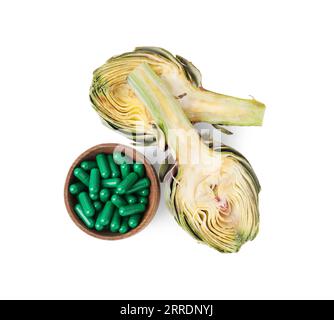 Fresh artichoke and pills isolated on white, top view Stock Photo