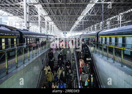 220117 -- GUIYANG, Jan. 17, 2022 -- Passengers get off the trains at Guiyang Railway Station in Guiyang, southwest China s Guizhou Province, Jan. 17, 2022. The number of railway passenger trips during China s upcoming Spring Festival travel rush is expected to jump 28.5 percent from the holiday season last year, industry data shows. The 2022 Spring Festival travel rush will last from Jan. 17 to Feb. 25. During the 40-day travel season, also known as chunyun, many Chinese people will travel to meet their families for the Chinese Lunar New Year, or Spring Festival, which will fall on Feb. 1, 202 Stock Photo