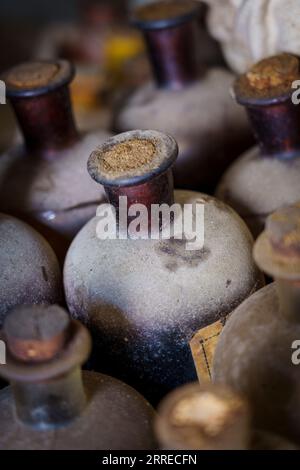 old empty bottles, essences for alcoholic beverages, old Ripoll winery, Llucmajor, . Majorca, Balearic Islands, Spain. Stock Photo